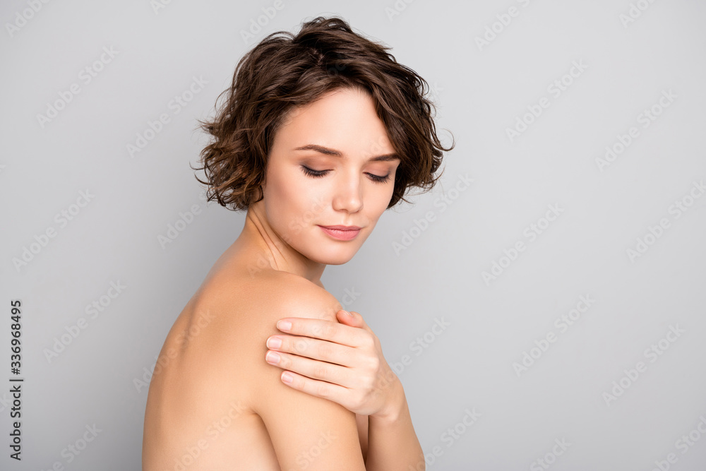 Portrait of minded pretty girl touch hand shoulders look enjoy her ideal fresh pure skin after bodycare peeling procedure isolated over gray color background - obrazy, fototapety, plakaty 