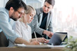 © Suteren Studio - Coworkers working together on a project. Business meeting in a bright office downtown.