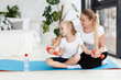 © FreepikCompany - Front view of mother and daughter exercising with weights at home
