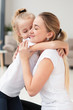 © FreepikCompany - Side view of daughter embracing smiley mother