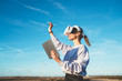 © BullRun - Woman having VR experience in wind farm