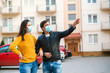 © volurol - Man and woman wearing medical mask outdoors. Coronavirus epidemic.