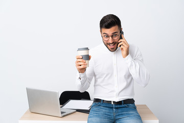 Poster - Young businessman holding a mobile phone