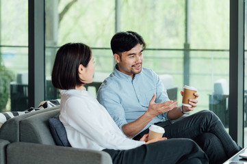 Wall Mural - Young Asian business man and woman