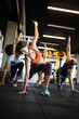 © NDABCREATIVITY - Fitness, sport, training and lifestyle concept. Group of people exercising in gym