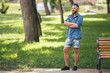 © Дмитрий Скорина - Young guy walking in the spring park. Sunny day. Vesna.Funny guy. A good mood.