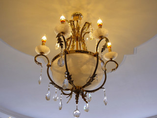 Chrystal chandelier lamp on the ceiling in a luxurious restaurant.