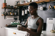 © visualspectrum/Stocksy - Slim Black Woman Pouring Green Juice