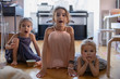 © Ira Efremova Photography/Stocksy - Three girls watching cartoons on a tablet