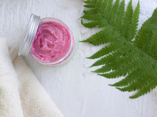 Spa  bath flat lay with natural cream or scrub jar, towel and fern leaf on white background.  Skincare cosmetic  concept. Homemade organic beauty products