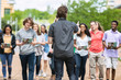 © Sean Locke Photography/Stocksy - Tour: Guide Leads Group In A Discussion
