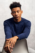 © Nicklaus Walter/Stocksy - Studio Portrait of Young Handsome Mixed Race Man