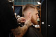 © Milles Studio/Stocksy - Professional barber working with man