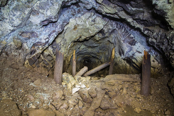 Underground abandoned platinum ore mine tunnel collapsed wooden timbering