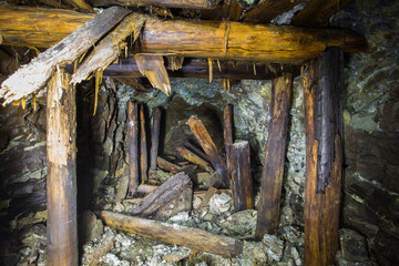 Underground abandoned platinum ore mine tunnel collapsed wooden timbering