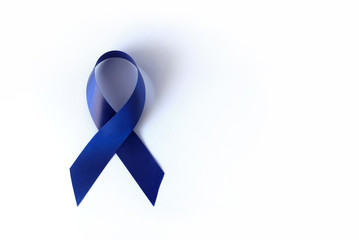 Wall Mural - Blue ribbon on a white background is a symbol of the problem of Stevens-Jones syndrome, colon cancer, problem of hydranencephaly, chronic fatigue syndrome, myalgic encephalomyelitis. Week no smoking