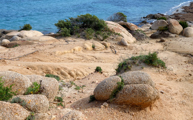 Wall Mural - Textured rocks formation on the beach in Villasimius, Sardinia, Italy. Holidays, the best beaches in Sardinia.
