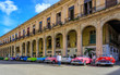 Havana Cuba Collection of vintage classic american car in a typical colorful street with sunny blue sky 