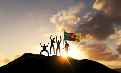 Wall Mural - A group of people celebrate on a mountain top with Cameroon flag. 3D Render