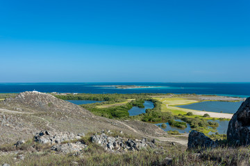 Top view of the touristic airport  in Gran Roque  with the island of Madrisky in the background (Los Roques Archipelago, Venezuela).