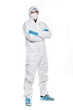 Young man in chemical protective suit making stop gesture on white background. Virus research