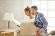 © lenetsnikolai - happy Young couple moving in new home