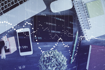 Double exposure of technology theme drawing over work table desktop. Top view. Global data analysis concept.