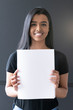 Woman of color holding a blank letter-sized or A4 mockup.