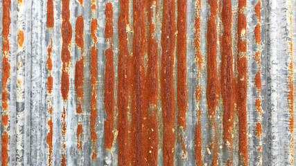 Wall Mural - Rust on Galvanized corrugated sheet, rustic background, weathered background. Metal sheet with rusty.