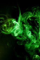 Green smoke motion on black background.