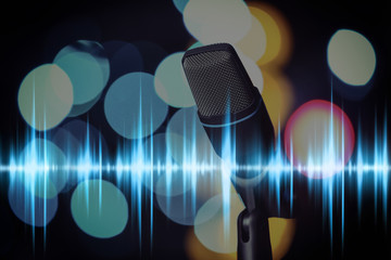 Wall Mural - Microphone and radio wave on dark background, bokeh effect