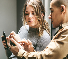 Poster - Man showing his smartphone to his friend