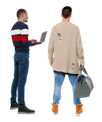 Back view two man in sweater with laptop.