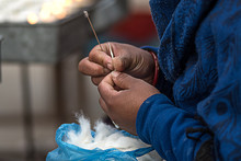 Lady Preparing Cotton Wick  For Butter Lamp