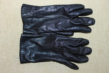 Old black leather gloves. Russia.