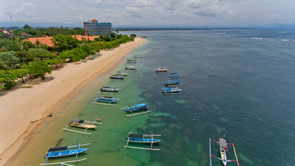 Wall Mural - Aerial view of traditional balinese fishing boats in lagoon at anchor.