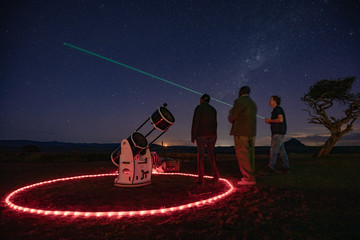 star gazing at night with a telescope