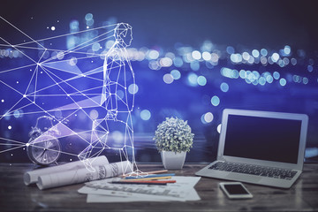 Desktop computer background in office and start up theme hologram drawing. Double exposure. Startup concept.