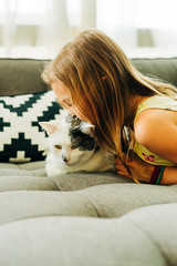 Wall Mural - Little Girl Petting White Cat