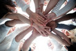 © ASDF - bottom view . group of young people joining their palms together