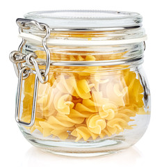 Dried italian pasta spiral Fusilli in a closed transparent glass jar with rubber seal and metal clamp on lid isolated on white background