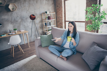 Wall Mural - Top above high angle view full size photo of positive cheerful girl have covid-19 free time quarantine relax watch tv switch channels hold coffee beverage mug sit divan legs crossed in house