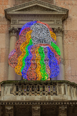 Italy, Milan, 13 February 2020, multicolored lighting on a historic building