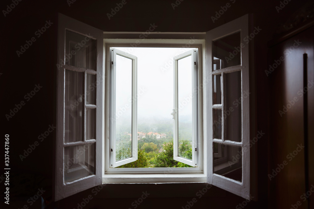 Wide open window with amazing countryside view on foggy day. Stay home concept. Scenery view from the house. Travel to Spain and holidays concept. Open a window to air the room. Ventilate your house. - obrazy, fototapety, plakaty 