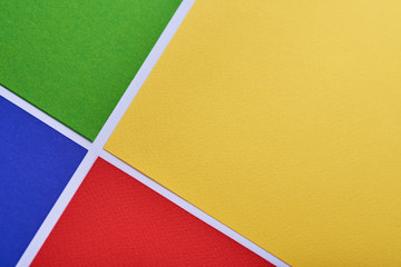 multi-colored minimalistic geometric paper background. green, yellow, blue and red. pattern. it is m