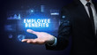 © ra2 studio - Hand of Businessman holding EMPLOYEE BENEFITS inscription, business success concept