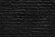 Black painted brick wall texture, dark background