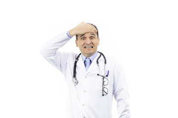 Poster - Middle-aged handsome doctor in white coat and stethoscope looking frustrated and shocked covering forehead with hand because of mistake, isolated white background, medicine concept