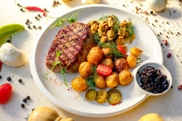 delicious steak with mushrooms and baked potatoes with jalapeno, healthy food