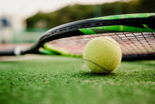Tennis Ball With Racket On Court During Day